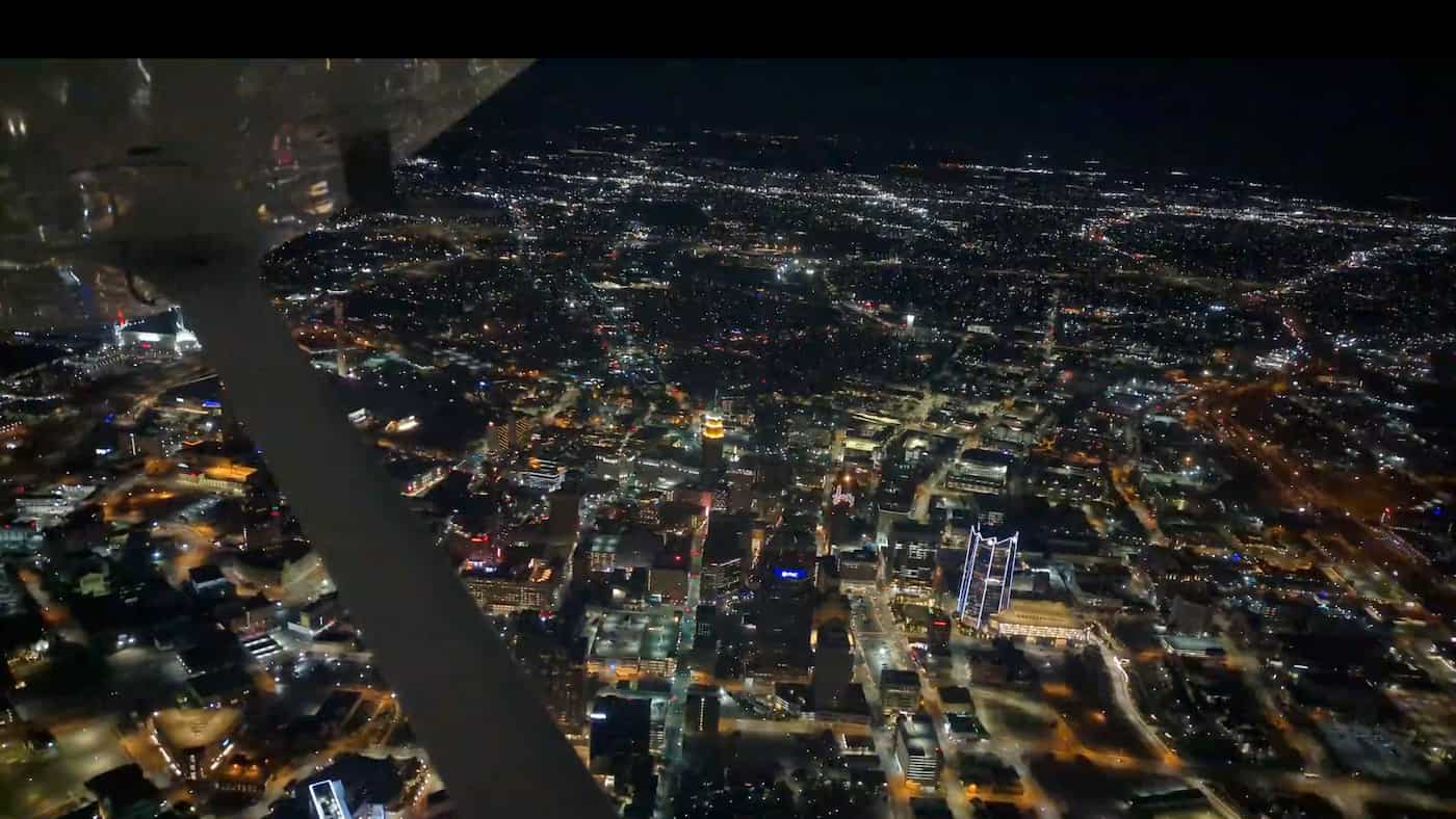 San Antonio, Texas as seen from above at night. A wing strut can be seen in the foreground.